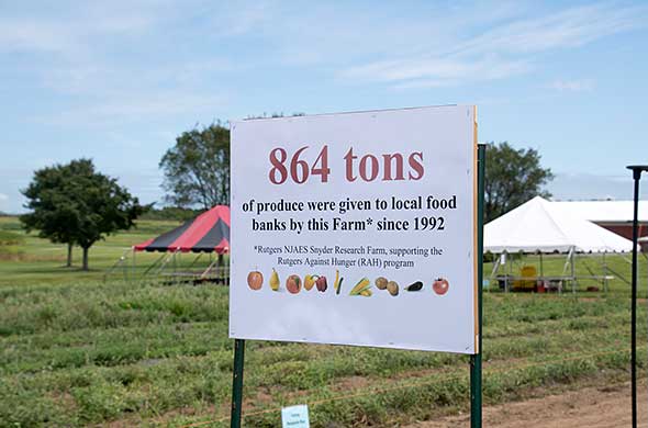 A sign that reads, '864 tons of produce were given to local food banks by this farm since 1992'.