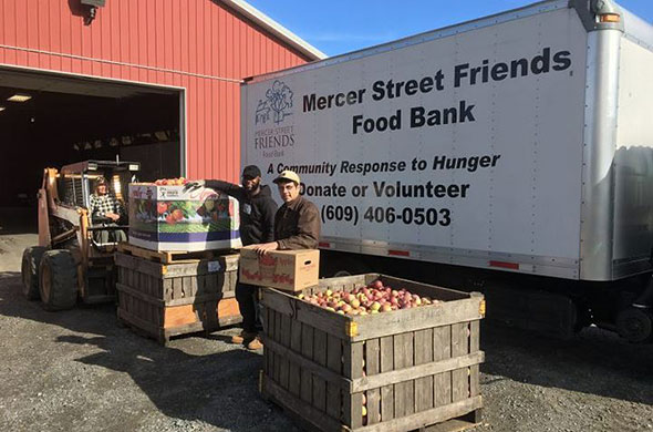 Men loading donated food onto a truck